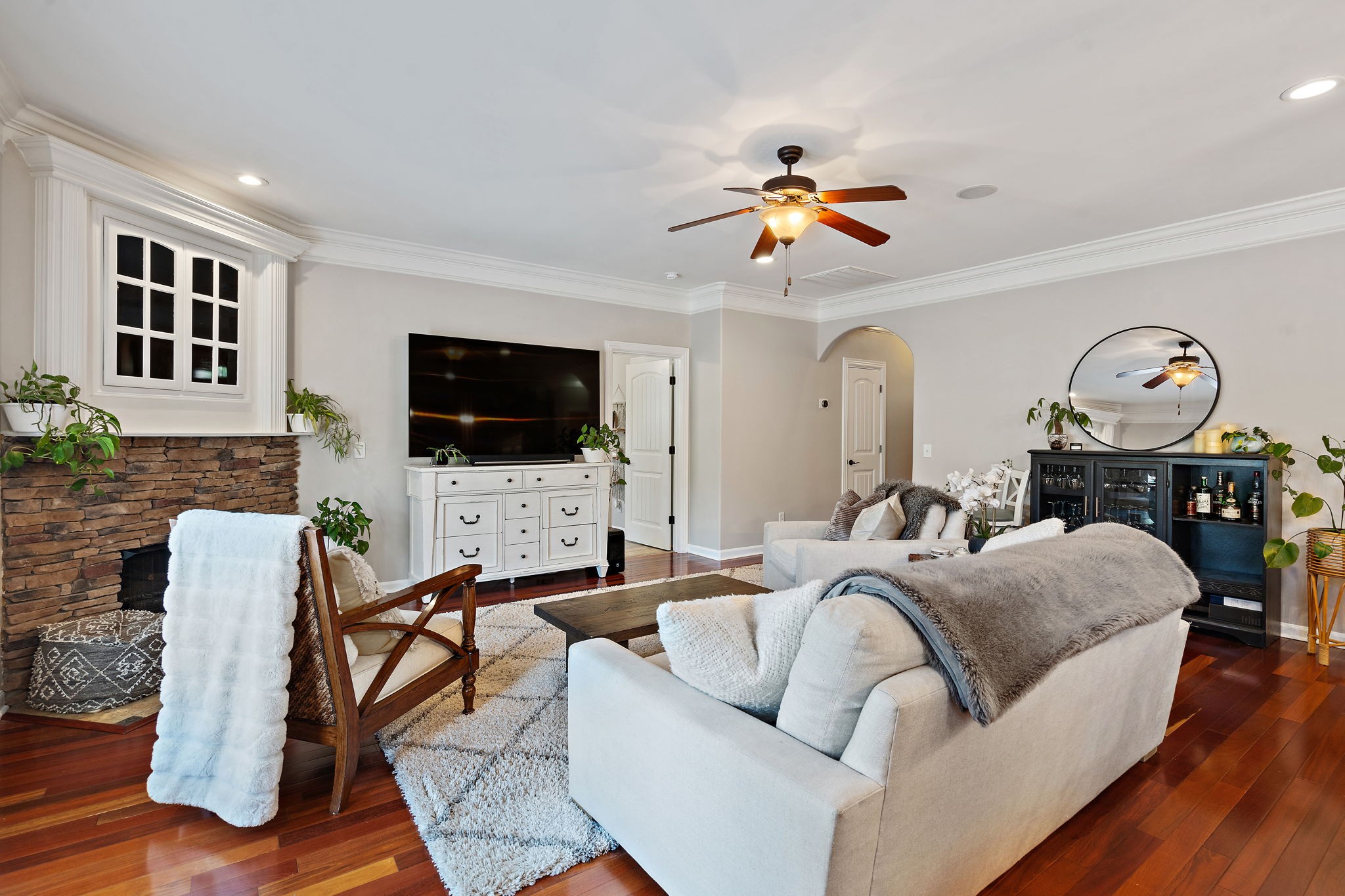 2521 Pennington Bend Road, Unit 214 Nashville, TN 37214 - Photo 6 of 25 a living room with furniture a flat screen tv and kitchen view