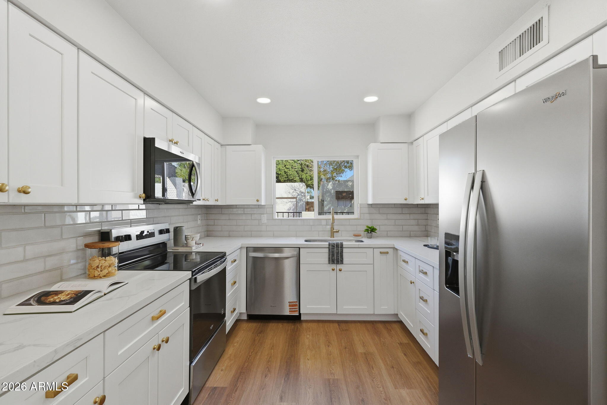 3011 West Sierra Street Phoenix, AZ 85029 - Photo 11 of 35 a kitchen with a sink stove and refrigerator