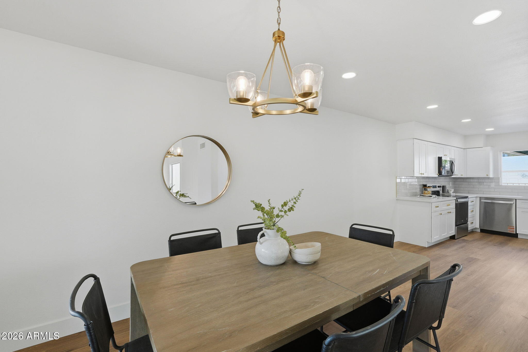 3011 West Sierra Street Phoenix, AZ 85029 - Photo 16 of 35 a view of a dining room furniture and chandelier