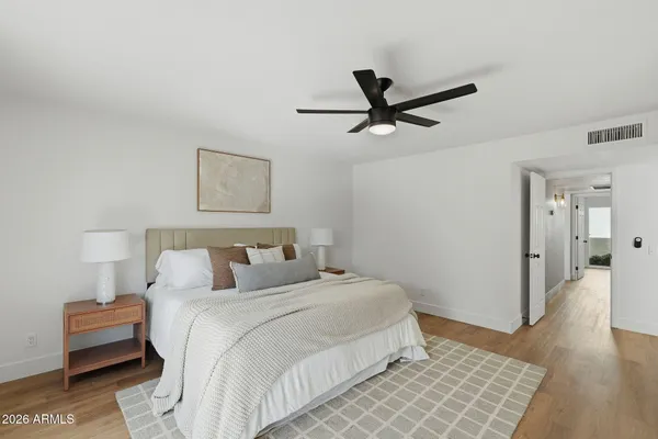 a bedroom with a bed and a couch