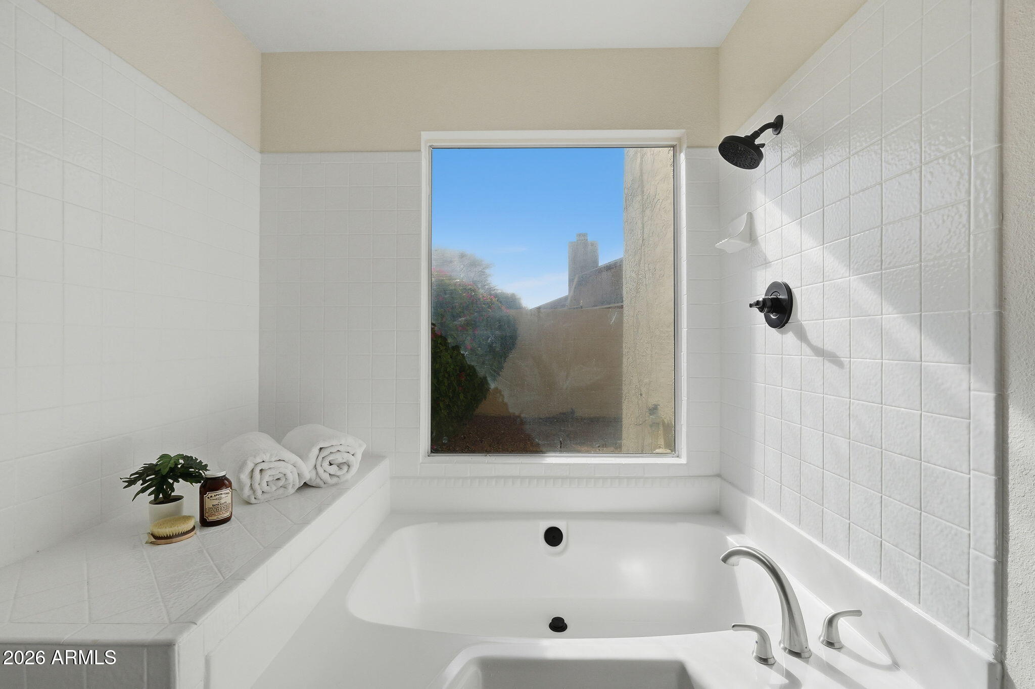 3011 West Sierra Street Phoenix, AZ 85029 - Photo 22 of 35 a bathroom with a tub and a shower