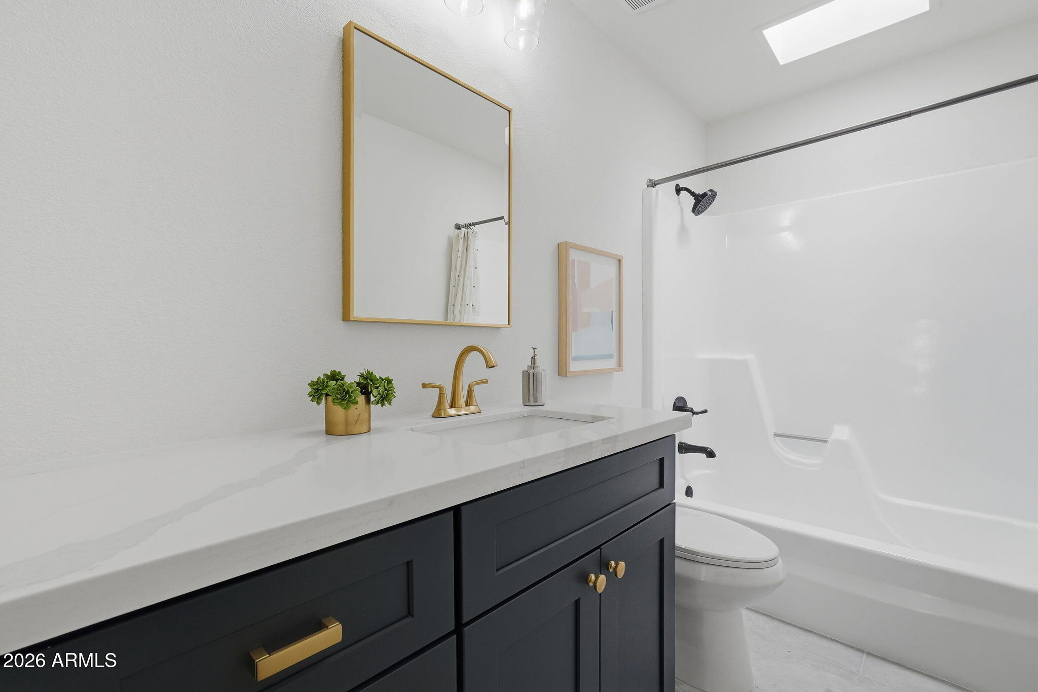 3011 West Sierra Street Phoenix, AZ 85029 - Photo 27 of 35 a bathroom with a granite countertop sink a toilet and a mirror