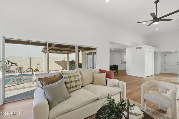 a living room with furniture and a large window