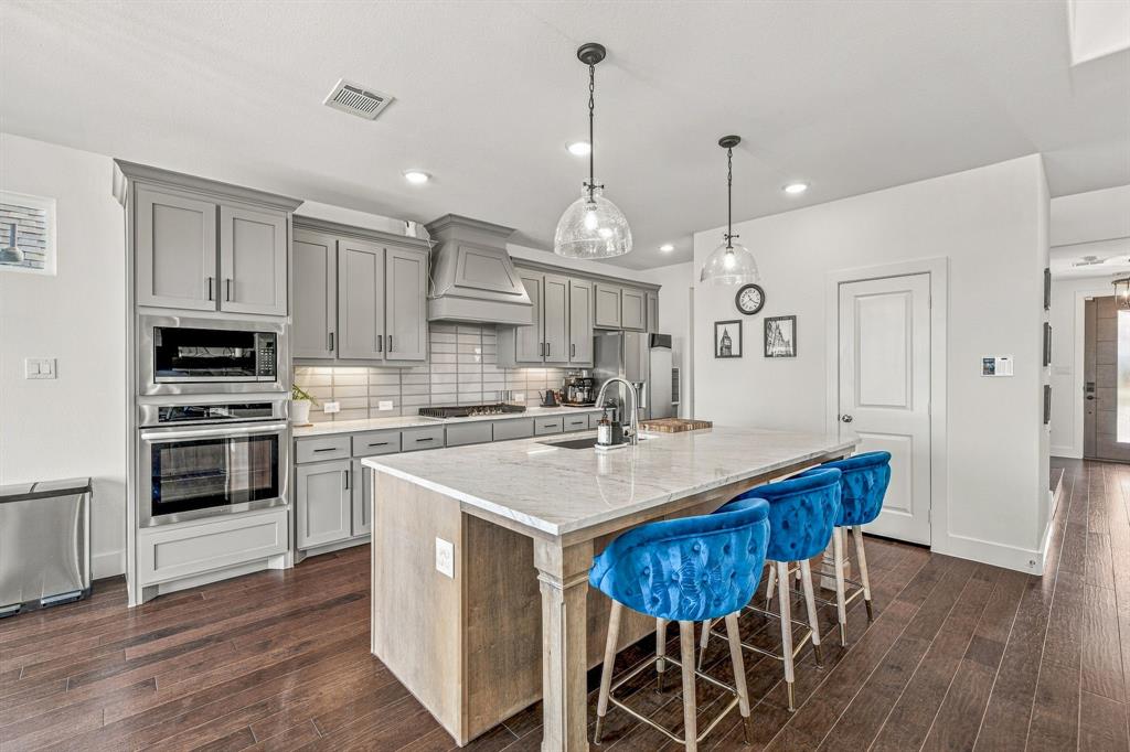 7112 Branch Road Fort Worth, TX 76179 - Photo 4 of 39 Kitchen with marble top island that has additional seating.