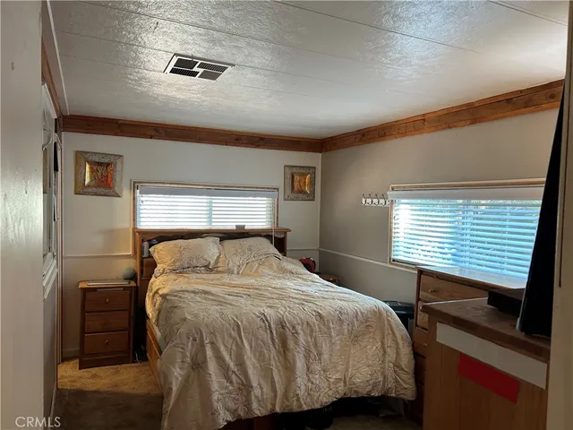 a living room with furniture and a piano