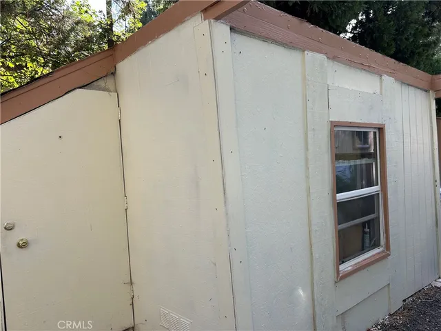 a view of bedroom with furniture and wooden floor