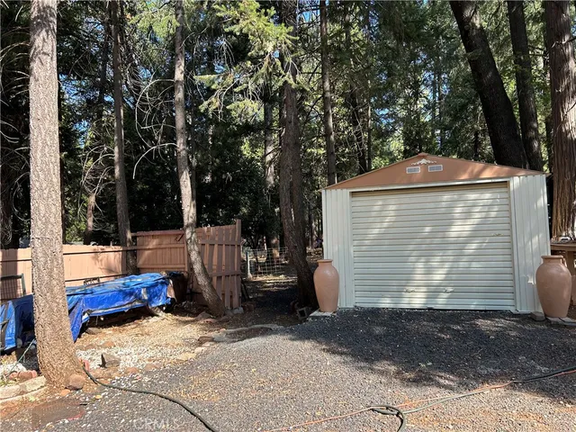 a view of a backyard of the house