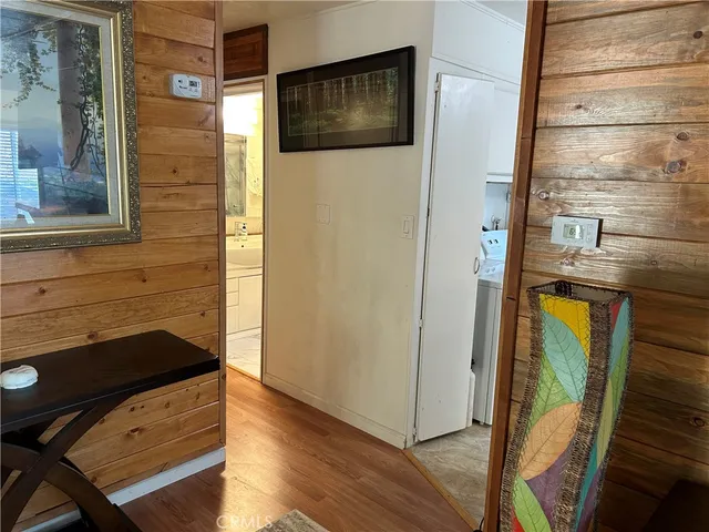 a kitchen with a sink and a stove next to a white refrigerator