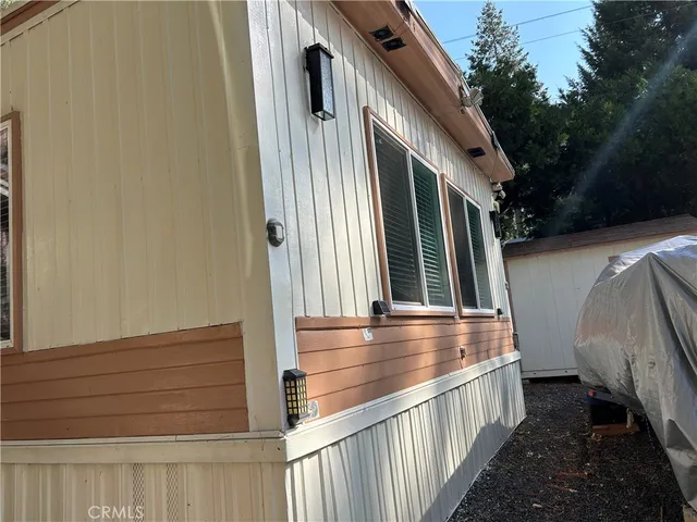 a view of a storage and utility room with washer and dryer