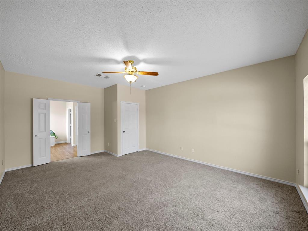 741 Aspen Court Allen, TX 75002 - Photo 23 of 40 Primary bedroom featuring fresh paint, carpet, and ceiling fan