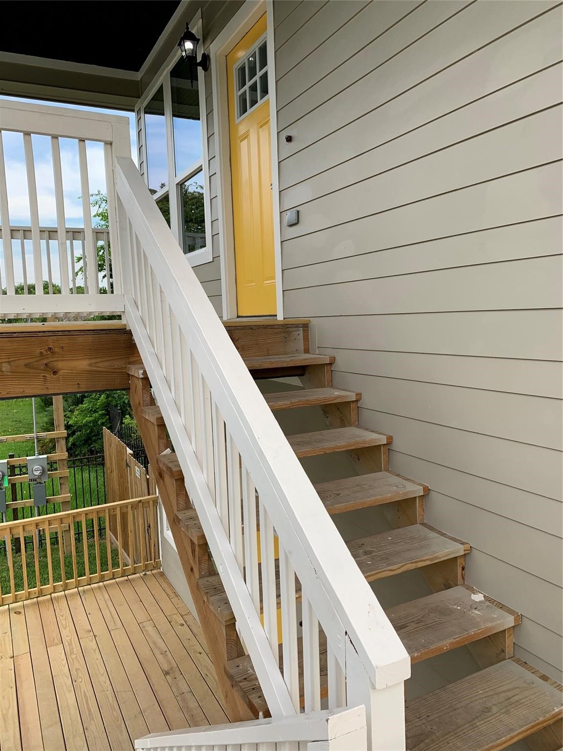 4221 Alvin Street, Unit A Houston, TX 77051 - Photo 12 of 15 a view of staircase with wooden floor and fence