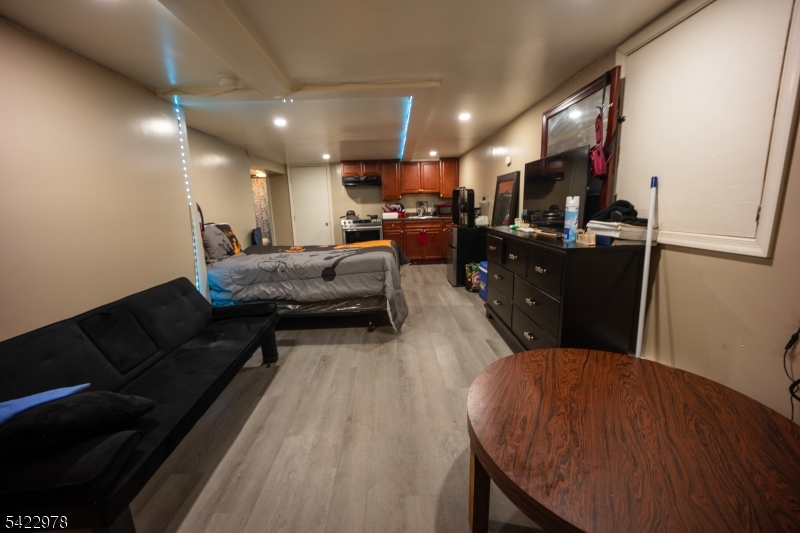 99 North 3rd Street Paterson, NJ 07522 - Photo 3 of 18 a living room with furniture and a flat screen tv