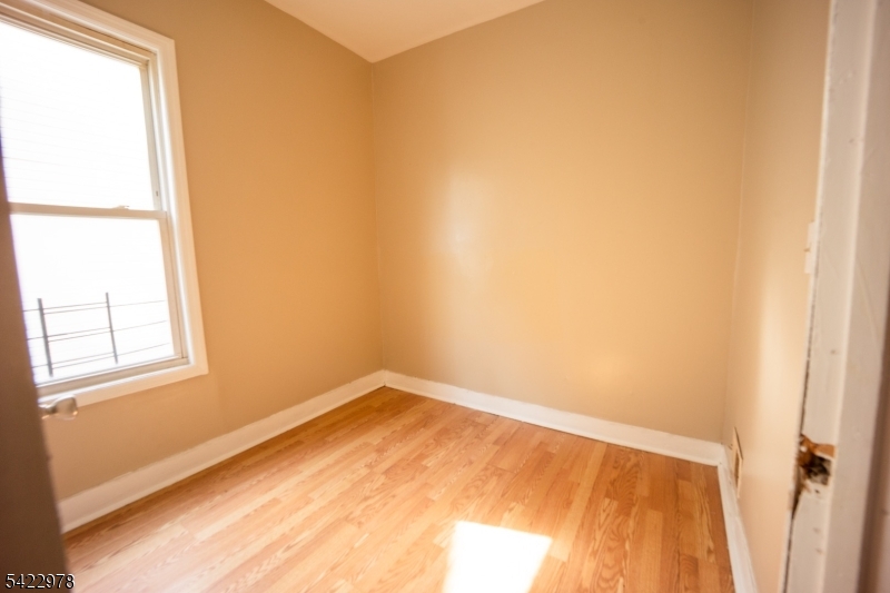 99 North 3rd Street Paterson, NJ 07522 - Photo 8 of 18 a view of an empty room and window