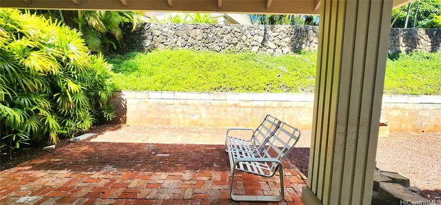 a view of a wooden door with a tree