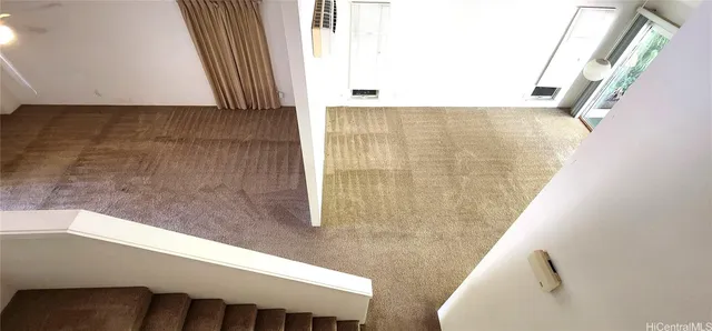 a view of balcony with wooden floor