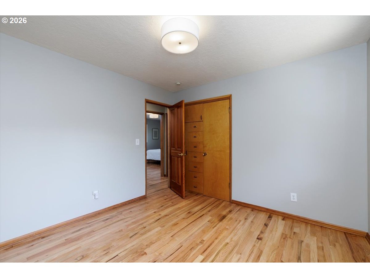 175 Northwest 95th Avenue Portland, OR 97229 - Photo 23 of 46 a view of an empty room and wooden floor