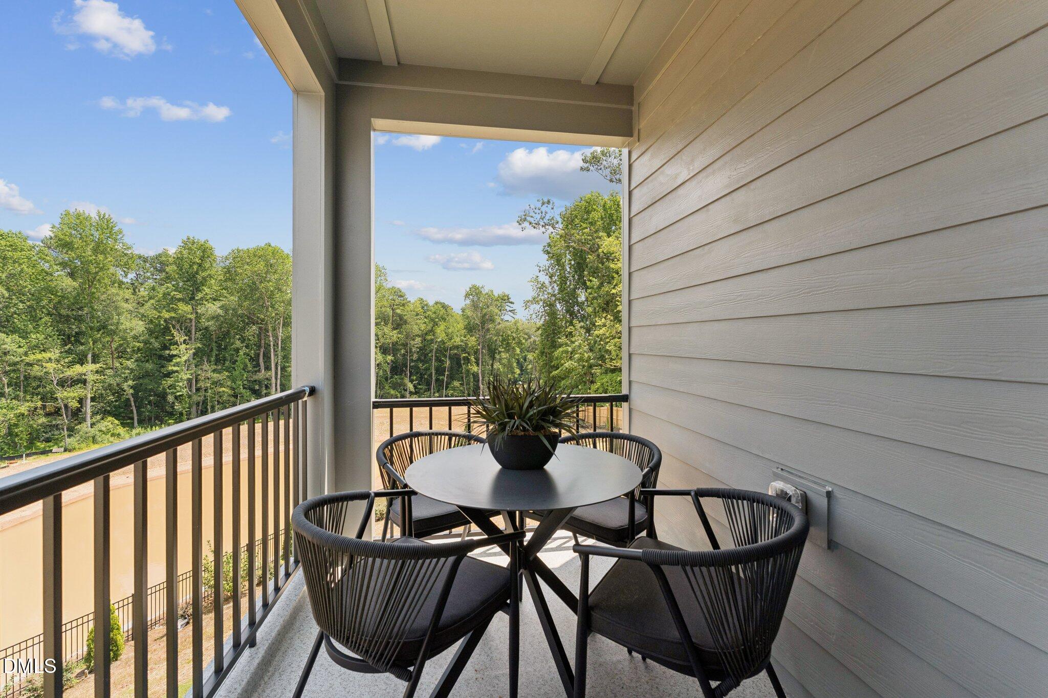 10604 Pleasant Branch Drive Raleigh, NC 27614 - Photo 12 of 40 a view of a balcony with chairs and a table