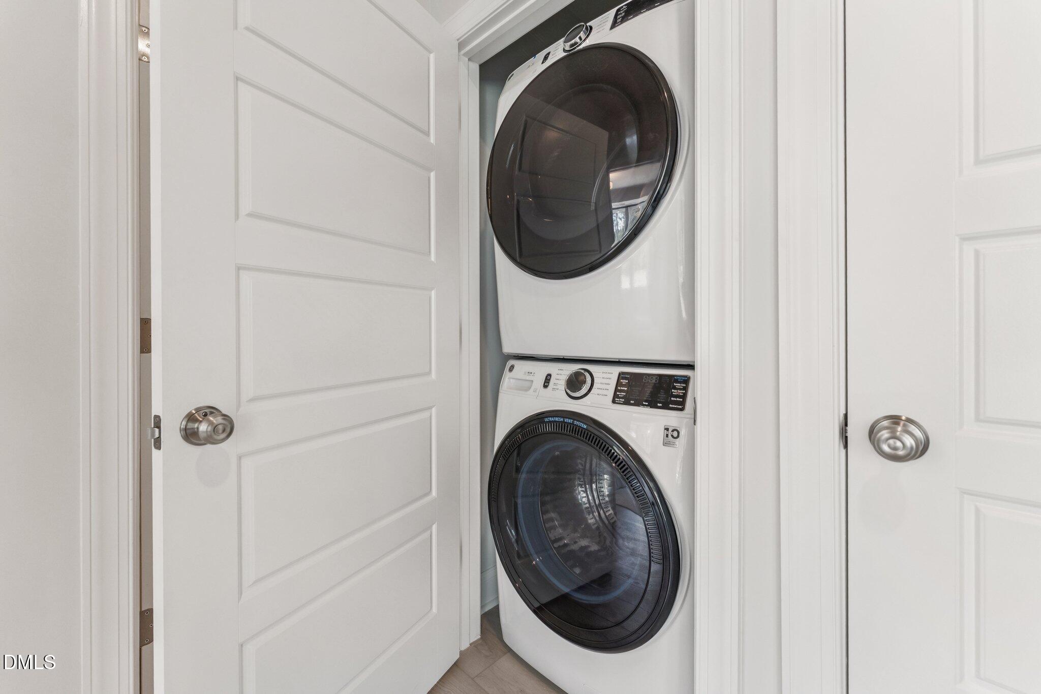 10604 Pleasant Branch Drive Raleigh, NC 27614 - Photo 18 of 40 a utility room with dryer and washer