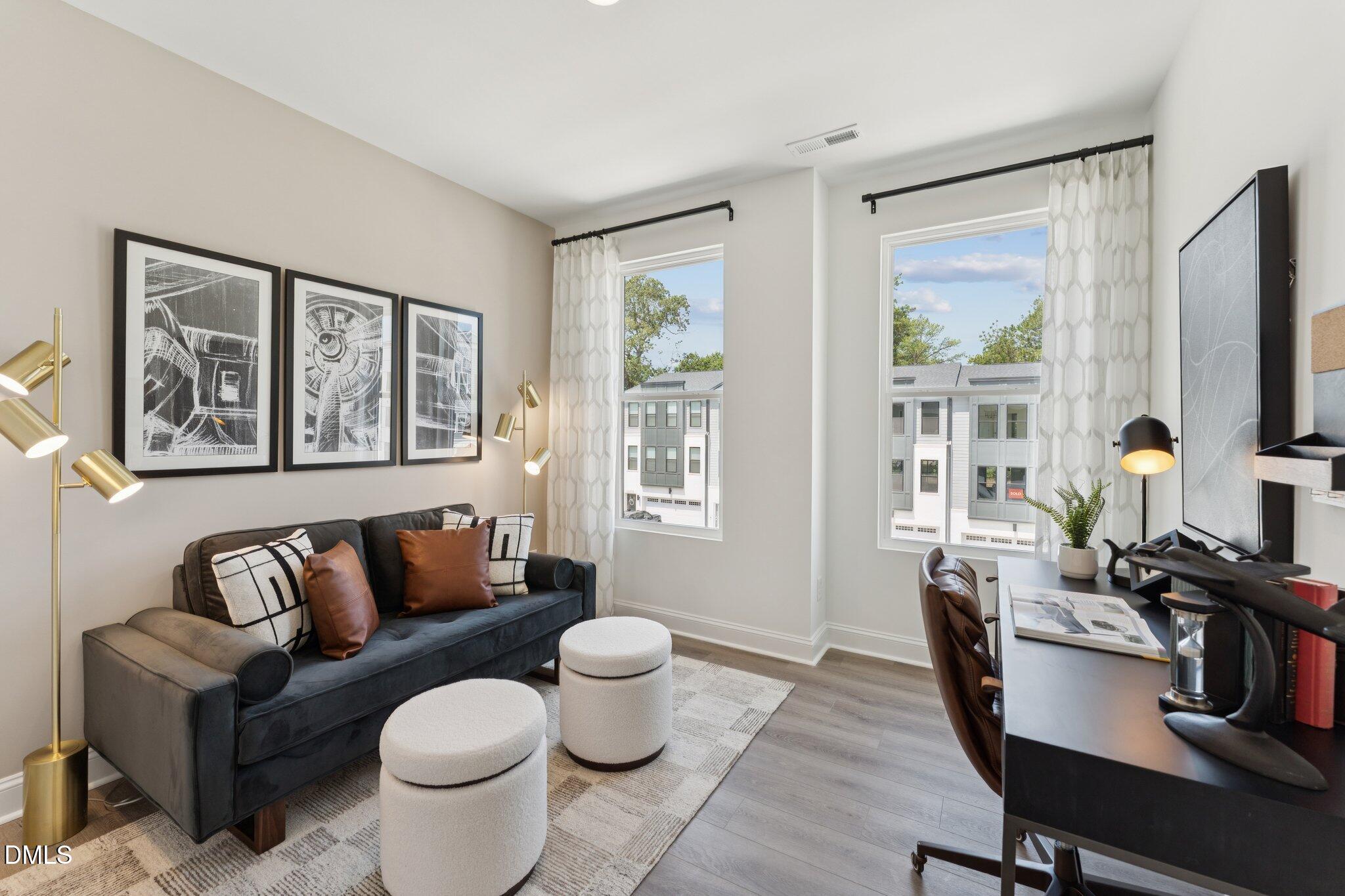 10604 Pleasant Branch Drive Raleigh, NC 27614 - Photo 21 of 40 a living room with furniture a flat screen tv and a window
