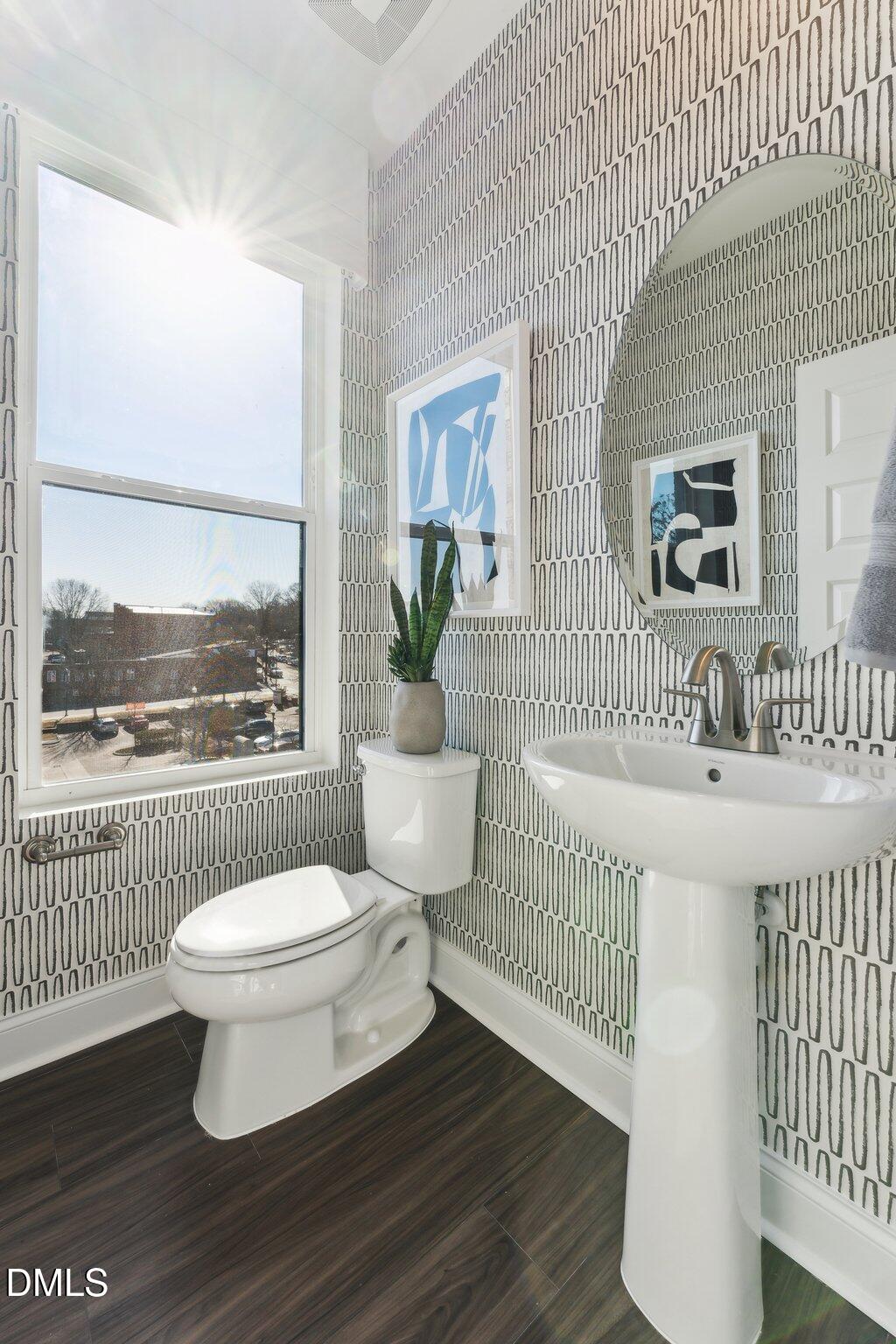 10604 Pleasant Branch Drive Raleigh, NC 27614 - Photo 7 of 40 a bathroom with a sink toilet and a window