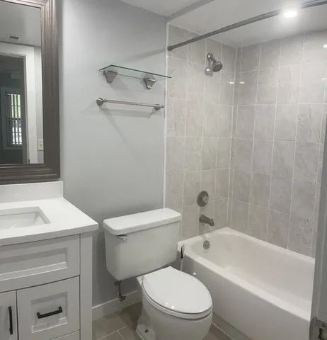 a bathroom with a sink a toilet and a bathtub