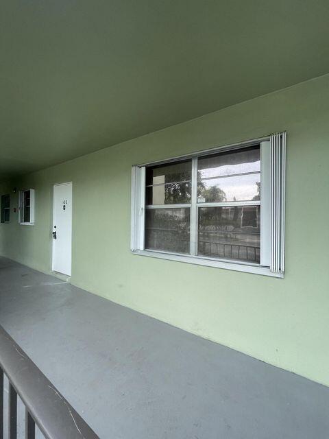 1638 Embassy Drive, Unit 102 West Palm Beach, FL 33401 - Photo 18 of 18 a view of empty room with window