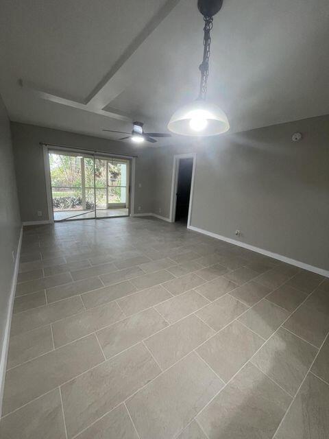 1638 Embassy Drive, Unit 102 West Palm Beach, FL 33401 - Photo 5 of 18 a view of an empty room with a window