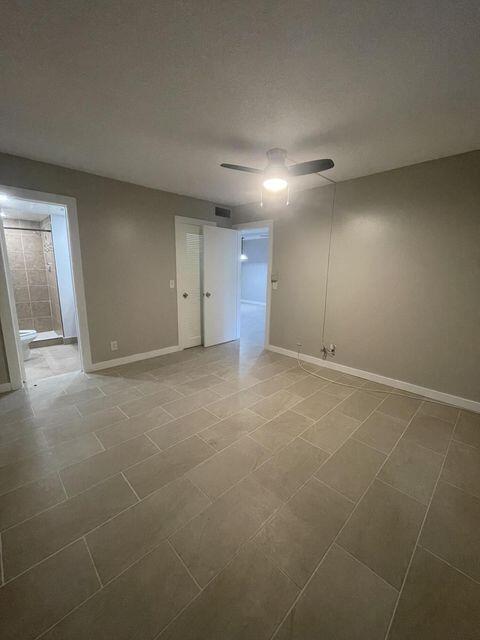 1638 Embassy Drive, Unit 102 West Palm Beach, FL 33401 - Photo 7 of 18 a view of an empty room