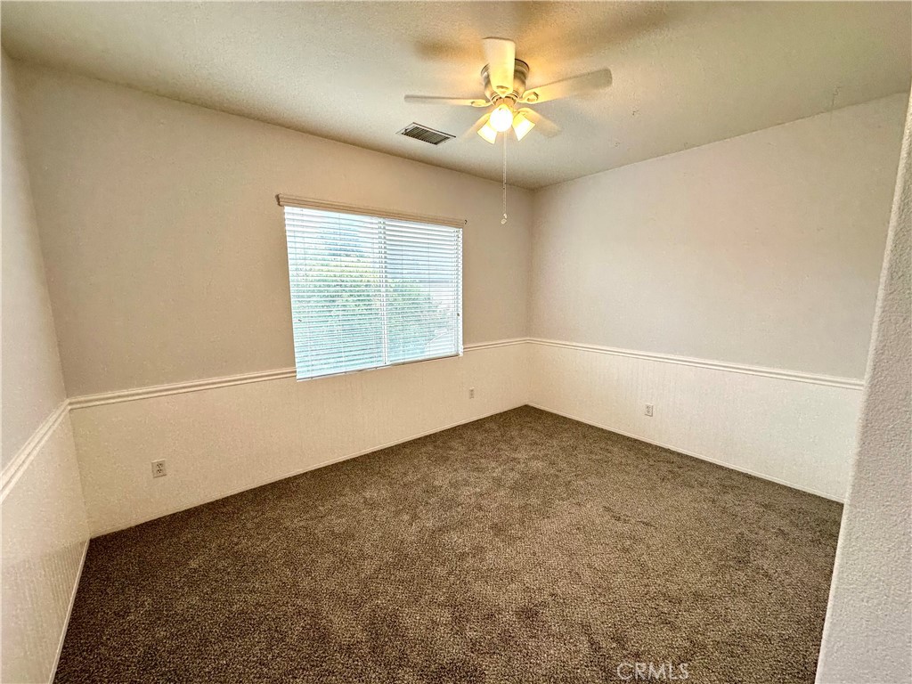 11146 Gardenhurst Court Riverside, CA 92505 - Photo 12 of 16 an empty room with a window