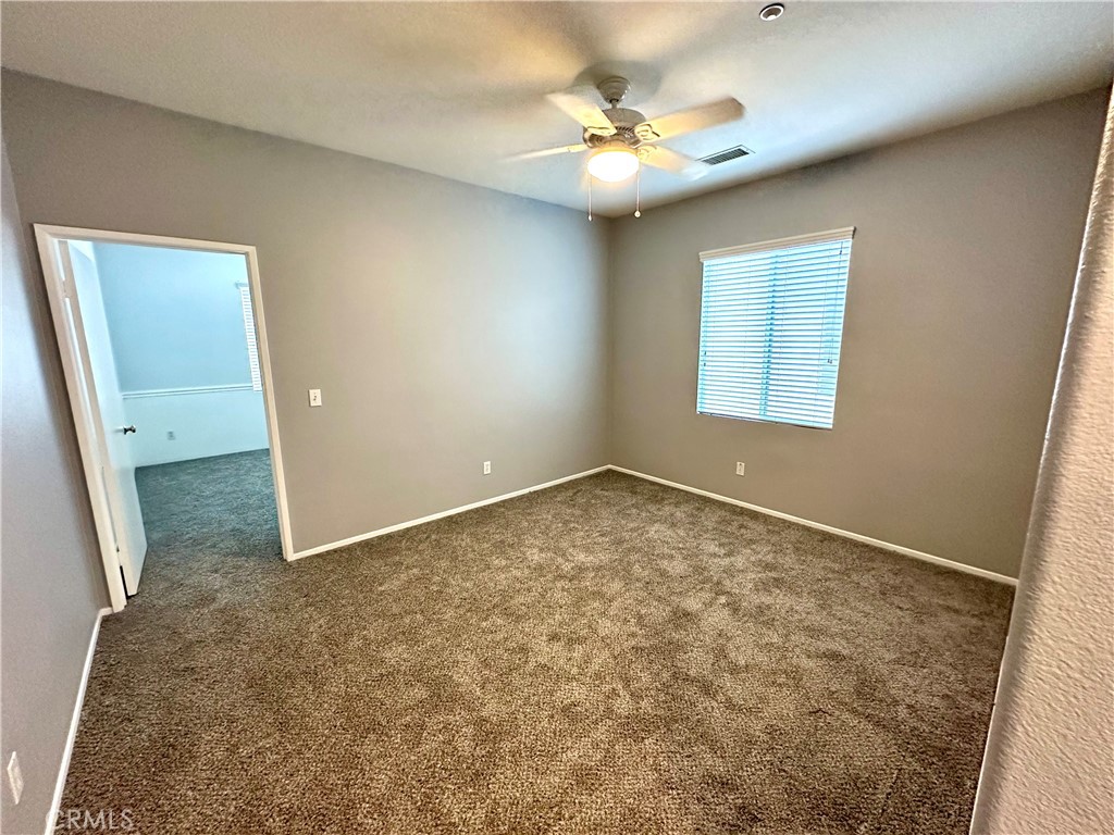 11146 Gardenhurst Court Riverside, CA 92505 - Photo 13 of 16 an empty room with a fireplace