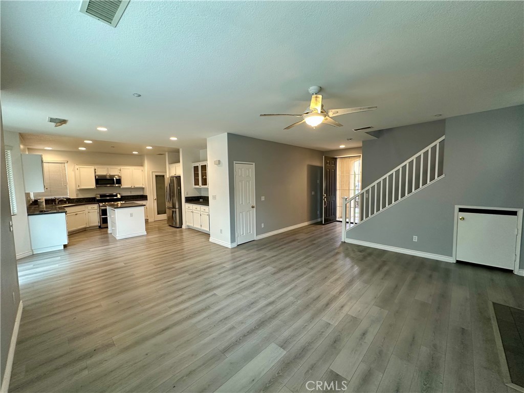 11146 Gardenhurst Court Riverside, CA 92505 - Photo 3 of 16 a view of a living room a kitchen with a sink and a kitchen area