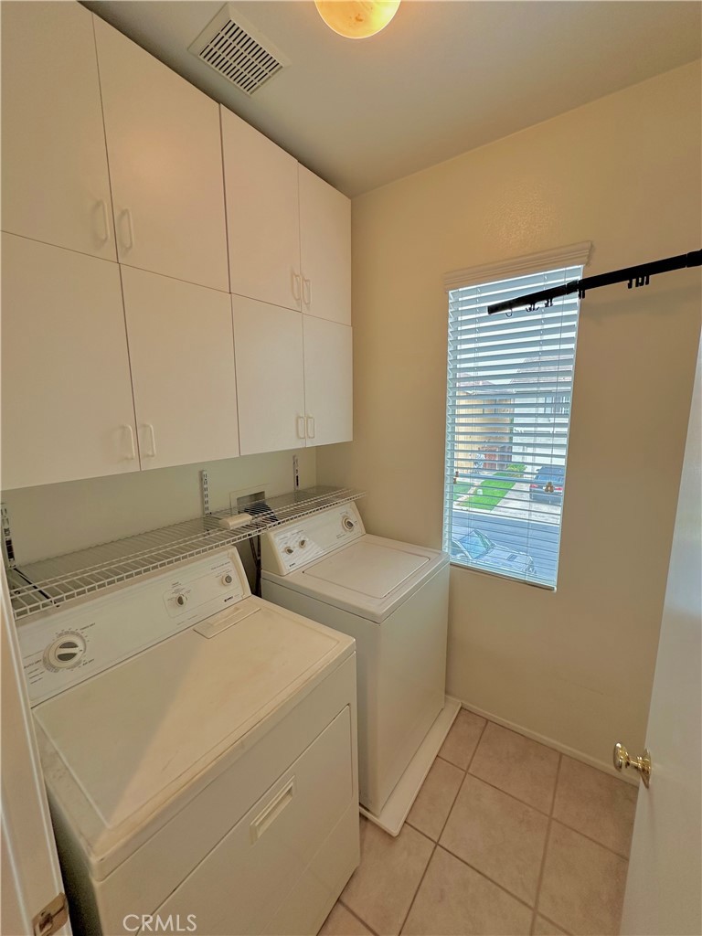 11146 Gardenhurst Court Riverside, CA 92505 - Photo 9 of 16 a utility room with dryer and washer