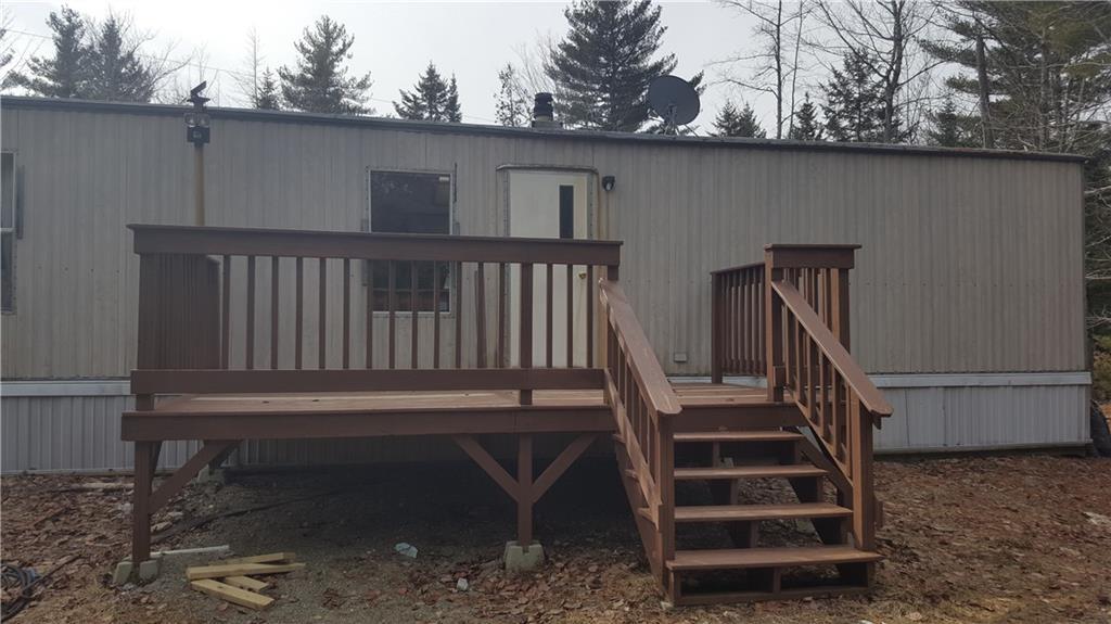 918 Springy Pond Road Otis, ME 04605 - Photo 6 of 8 A large back porch for summer...