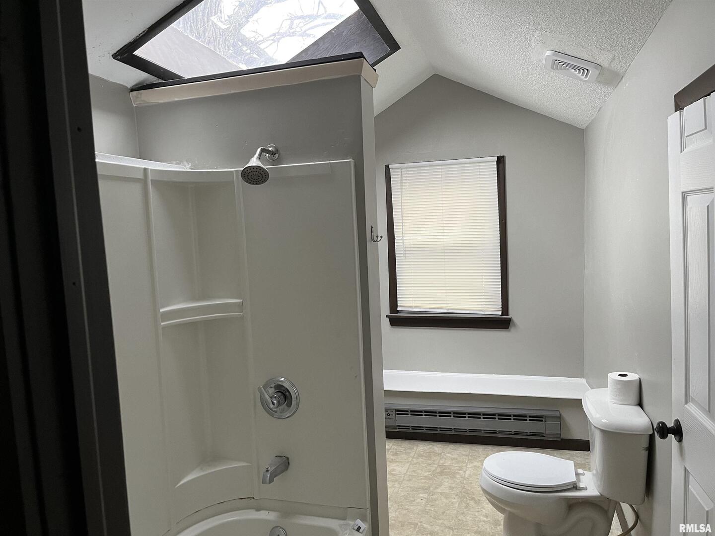 1802 Camanche Avenue Clinton, IA 52732 - Photo 17 of 17 a bathroom with a toilet a sink and bathtub