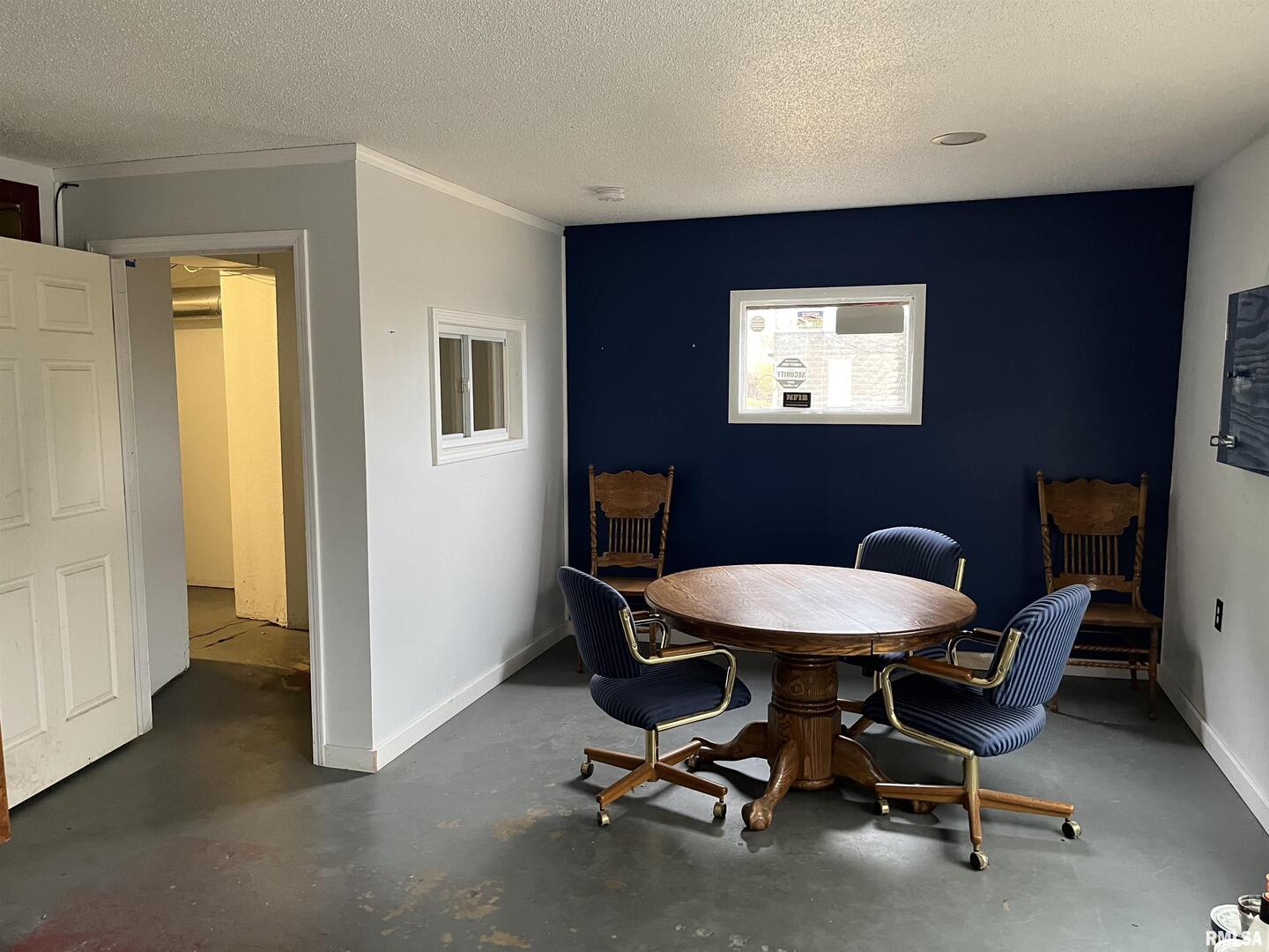 1802 Camanche Avenue Clinton, IA 52732 - Photo 7 of 17 a view of a room with a table and chairs