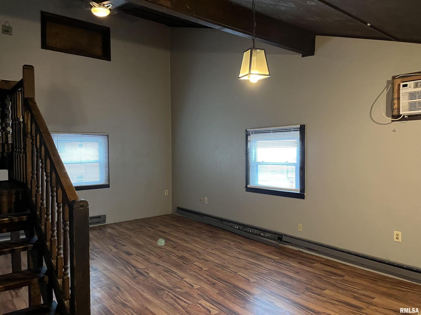 1802 Camanche Avenue Clinton, IA 52732 - Photo 8 of 17 a view of an empty room with wooden floor and a window