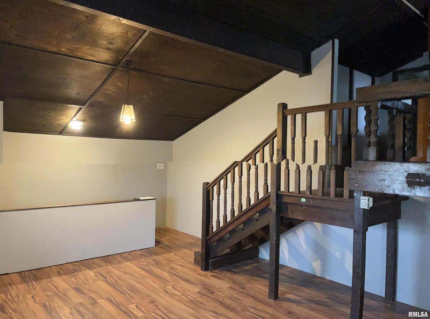 1802 Camanche Avenue Clinton, IA 52732 - Photo 9 of 17 a view of a hallway with wooden floor