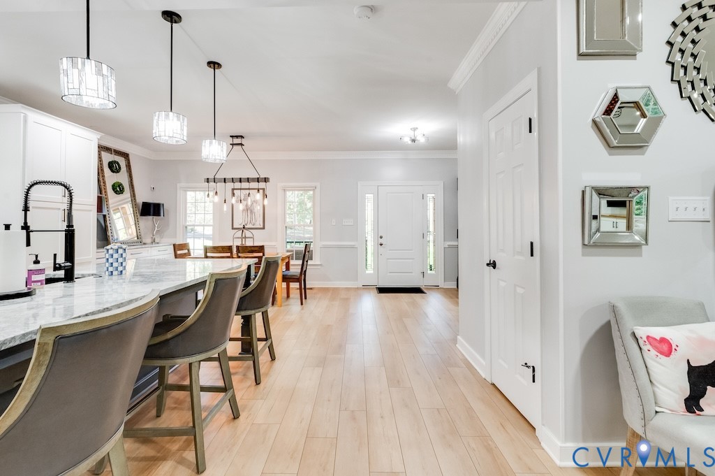 11802 Glendevon Road Chesterfield, VA 23838 - Photo 24 of 47 a open kitchen with stainless steel appliances granite countertop a refrigerator a sink dishwasher a dining table and chairs with wooden floor