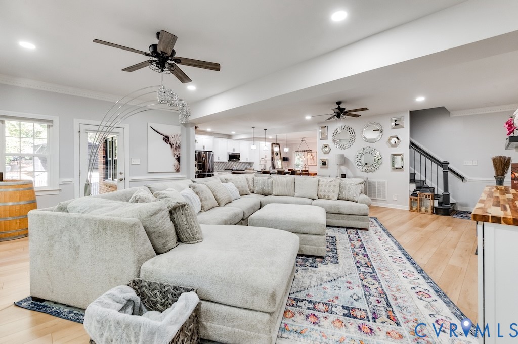 11802 Glendevon Road Chesterfield, VA 23838 - Photo 27 of 47 a living room with furniture and a wooden floor