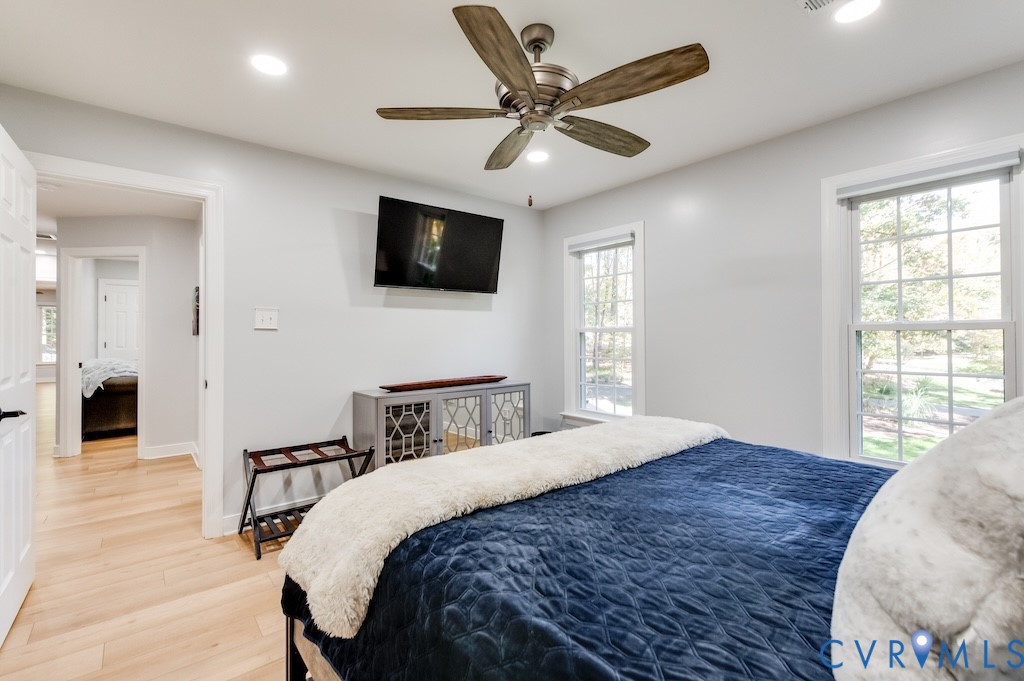 11802 Glendevon Road Chesterfield, VA 23838 - Photo 33 of 47 a bedroom with a bed a flat screen tv and a window