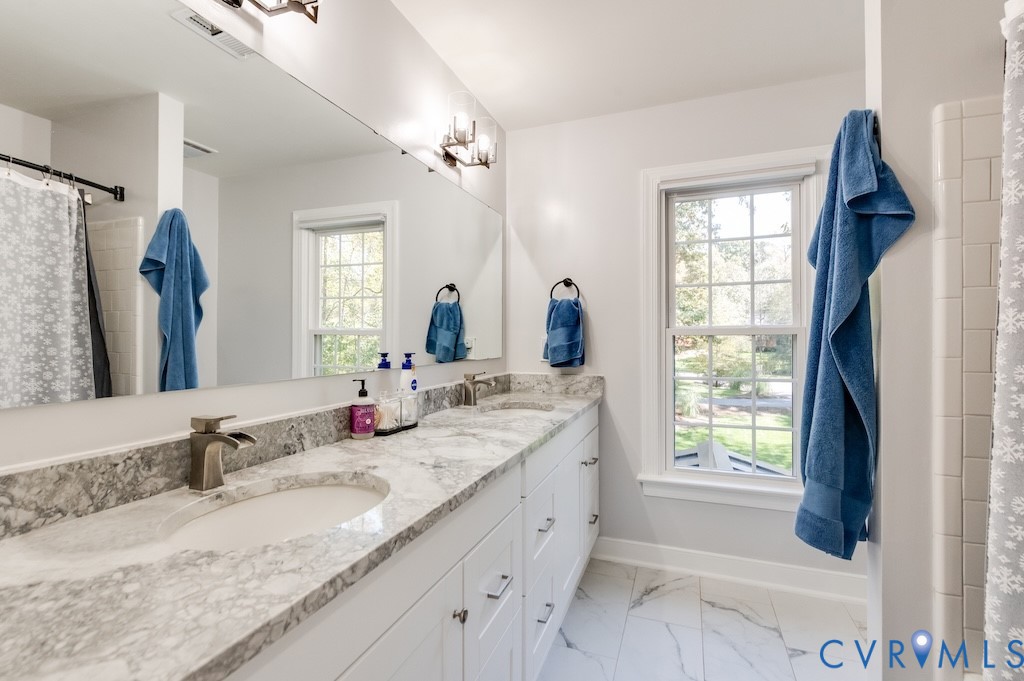 11802 Glendevon Road Chesterfield, VA 23838 - Photo 34 of 47 a bathroom with a granite countertop sink and a mirror