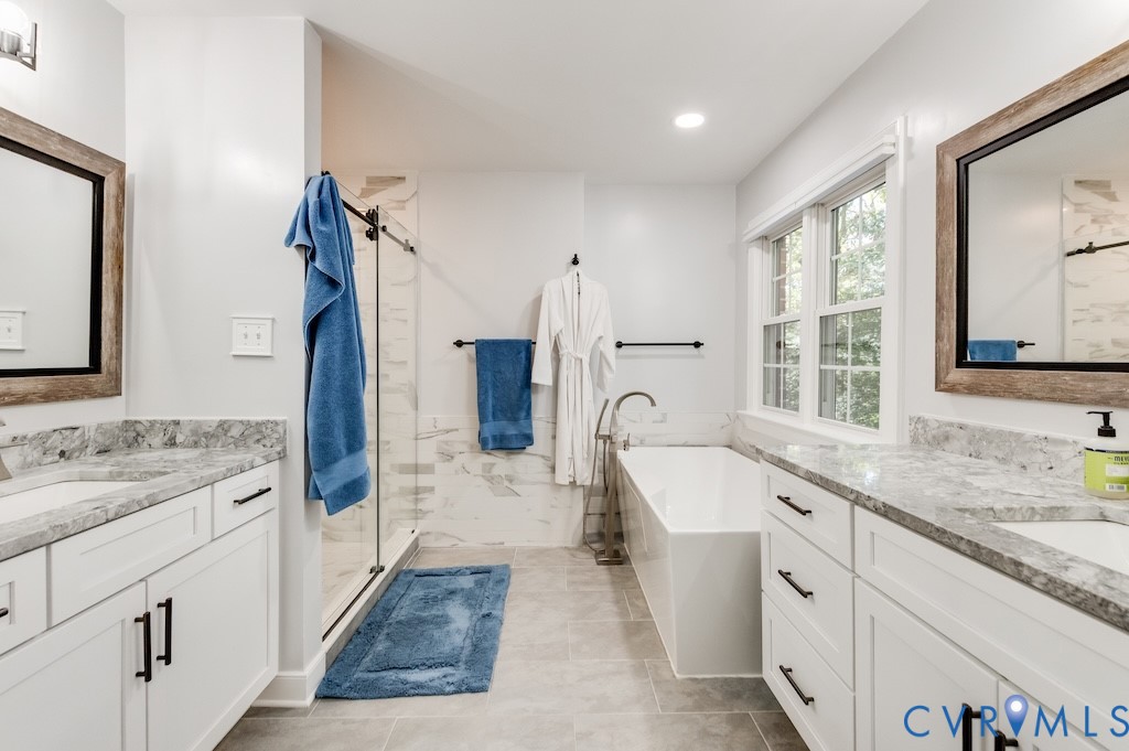 11802 Glendevon Road Chesterfield, VA 23838 - Photo 41 of 47 a bathroom with a granite countertop sink mirror and a bathtub