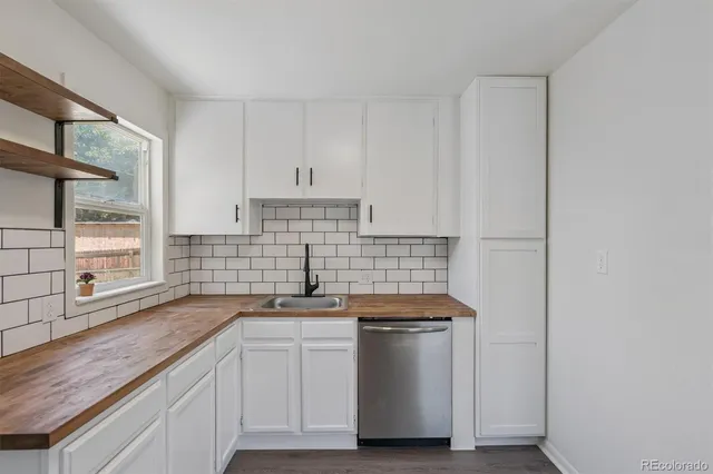a kitchen with a sink and cabinets