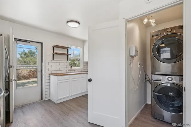a view of a hallway with washer and dryer