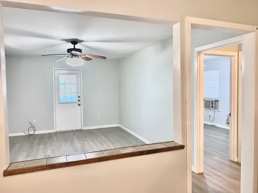 a view of room with a ceiling fan