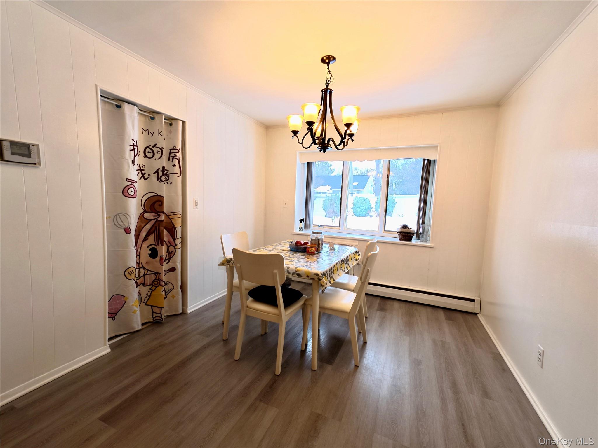 10 Kings Park Road Commack, NY 11725 - Photo 5 of 29 a view of a dining room with furniture and wooden floor