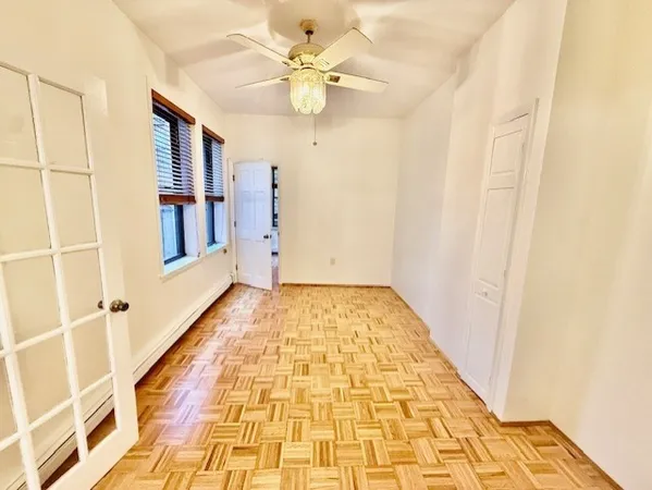 a view of a hallway with a chandelier