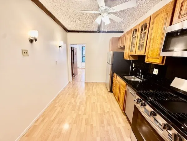 a view of a kitchen with a sink and dishwasher