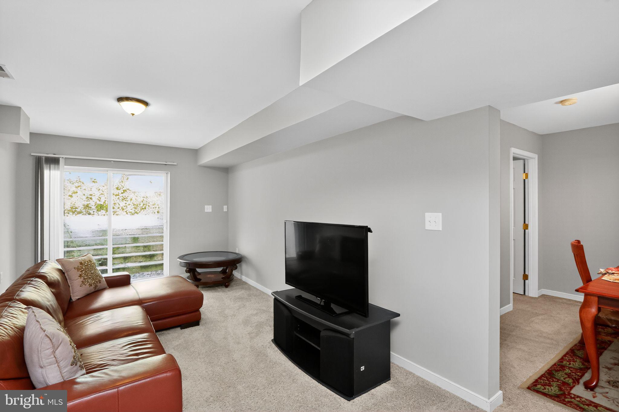 330 Powder Horn Drive Ruther Glen, VA 22546 - Photo 12 of 26 Light filled lower-level den w/ access to backyard