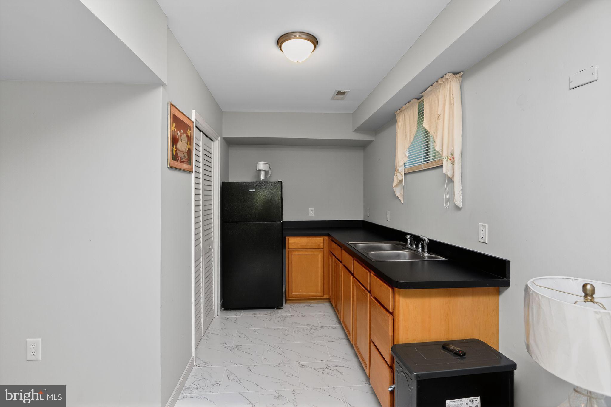 330 Powder Horn Drive Ruther Glen, VA 22546 - Photo 14 of 26 Lower-level kitchenette with maple cabinets